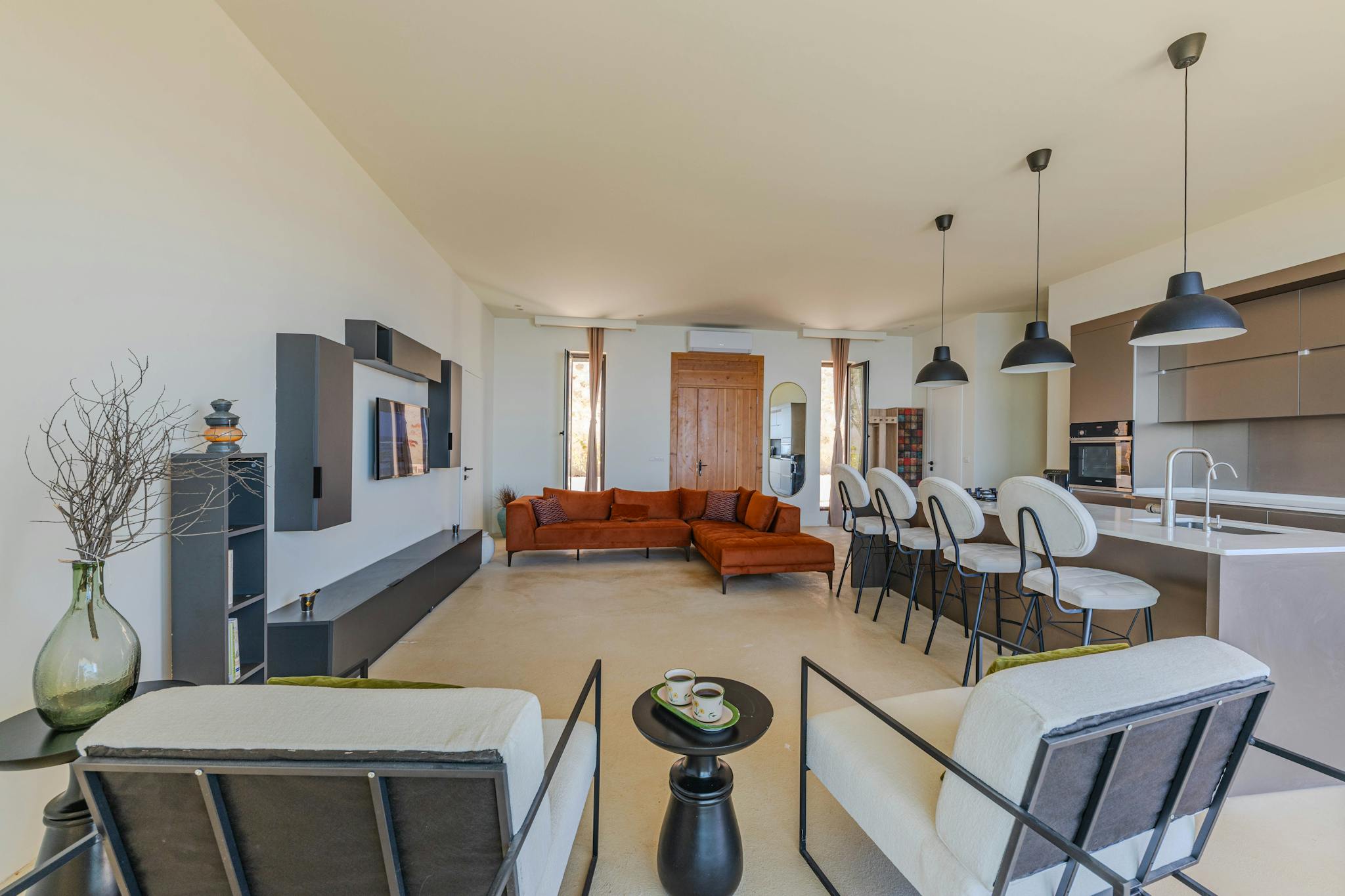 Spacious and elegant open-plan living area with contemporary design elements and luxury furnishings.